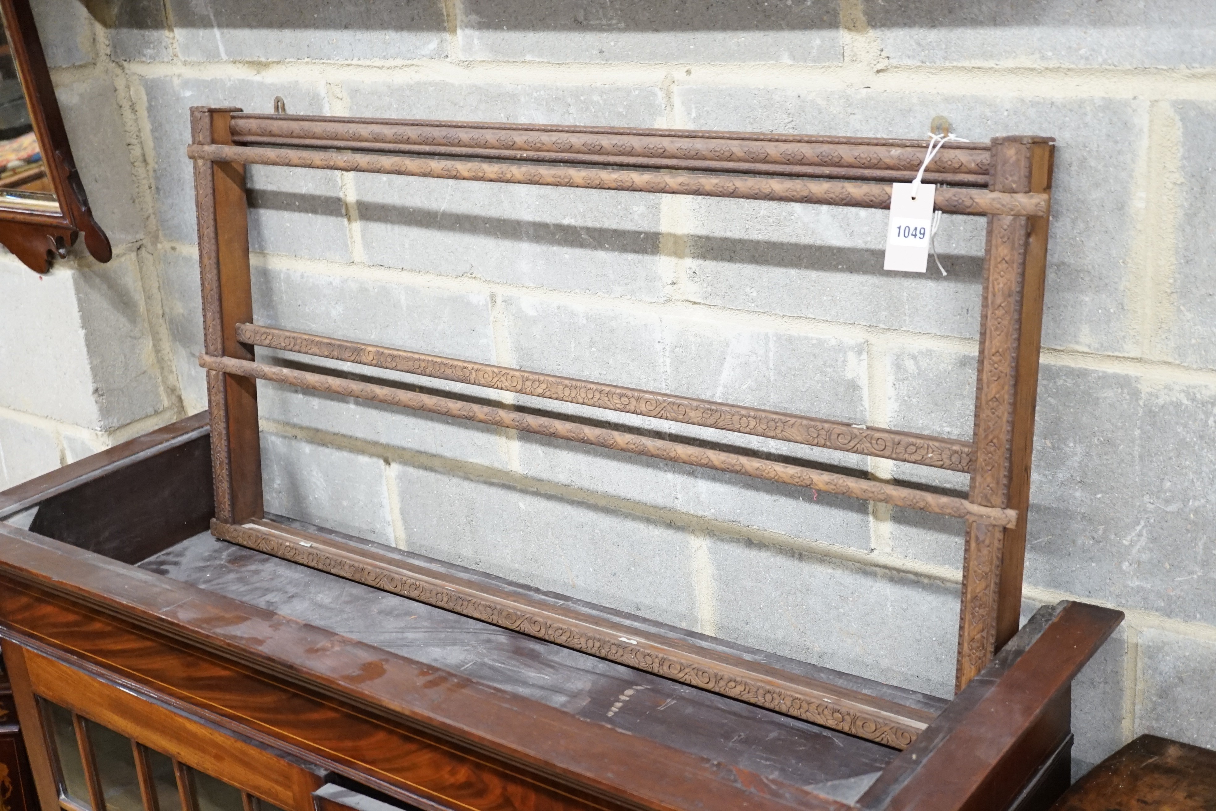 Two Continental carved beech plate racks, length 120cm, height 105cm